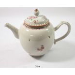 A Chinese famille rose teapot painted sprigs of flowers, 17cm tall