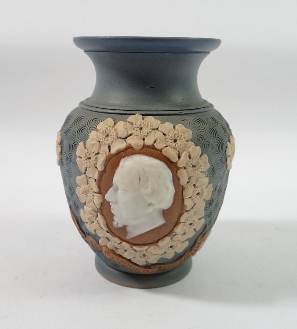 A Doulton Lambeth Silicon ware vase with commemorative portrait of Disraeli within border of