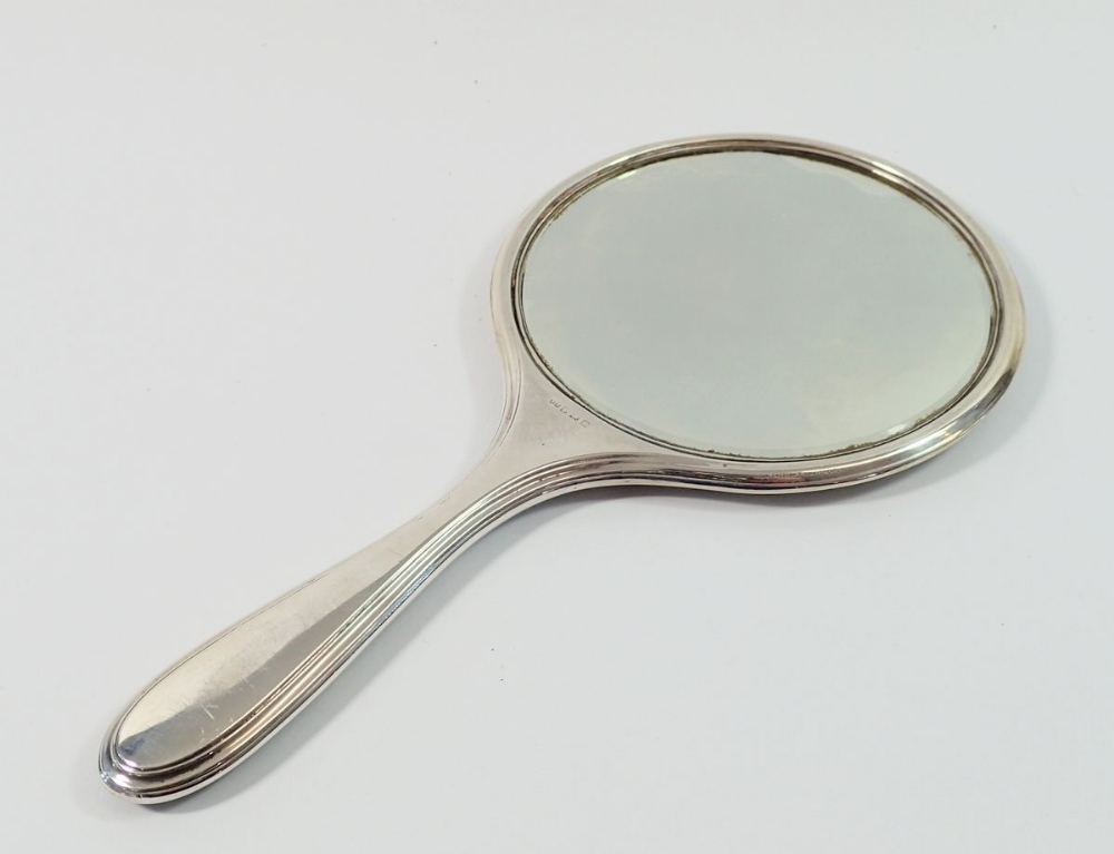 A silver hand mirror