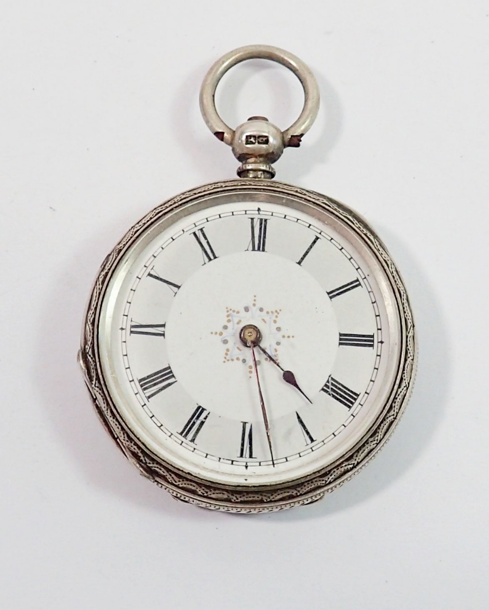 A silver Victorian fob watch with enamel dial