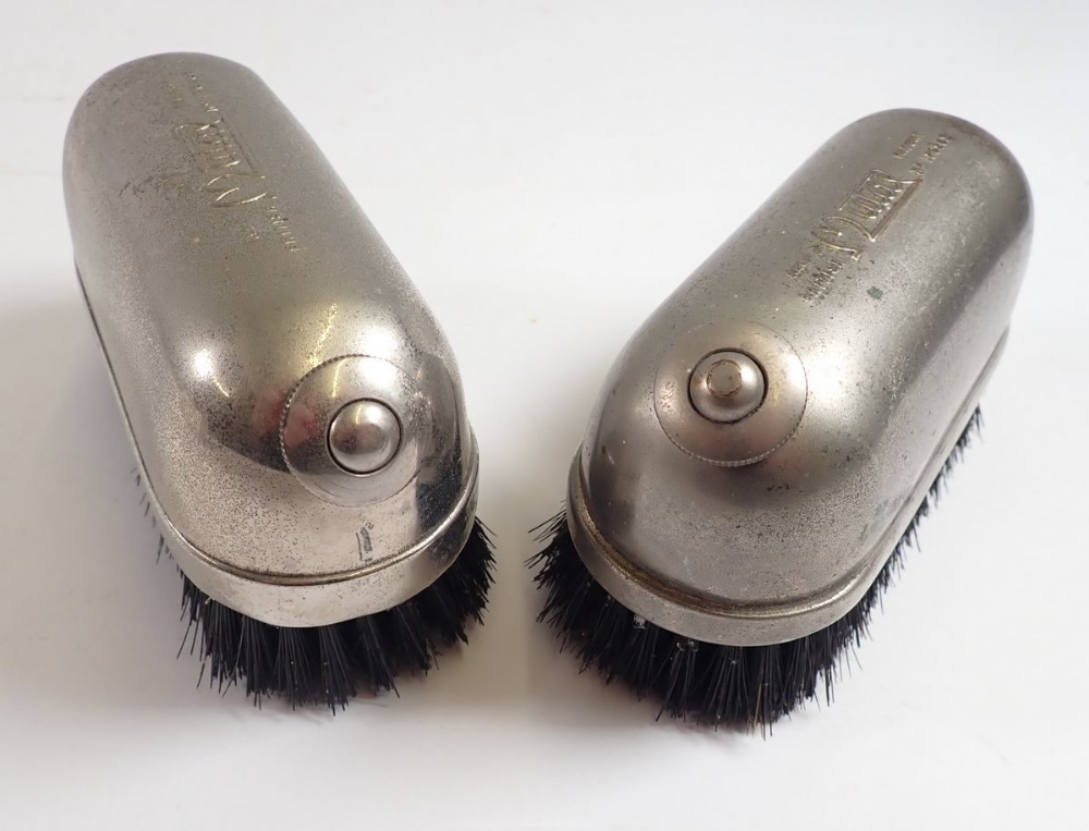 A pair of Mutax hot water hat brushes