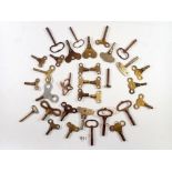 A collection of over 30 brass and other clock keys