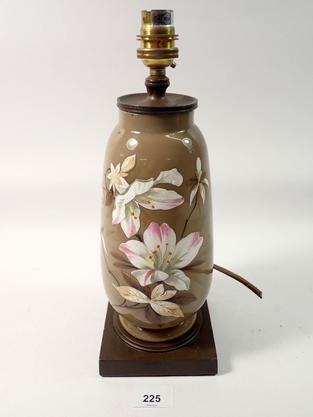 A Victorian brown glass table lamp enamelled flowers, 31cm