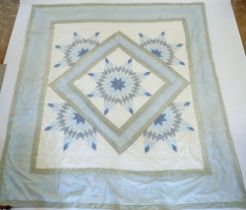 A machine stitched patchwork quilt 238x216cm