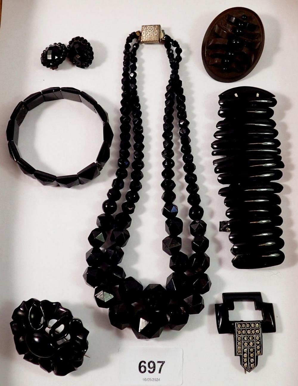 A collection of Victorian Whitby jet jewellery including brooches and necklace