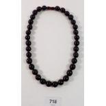 A cherry amber bead necklace, 50cm long, 57g