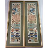 An early 19th century pair of Chinese embroidered sleeve panels decorated with vases of flowers,