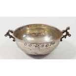 A small white metal two handled bowl engraved 'JJD 1631' 9cm wide