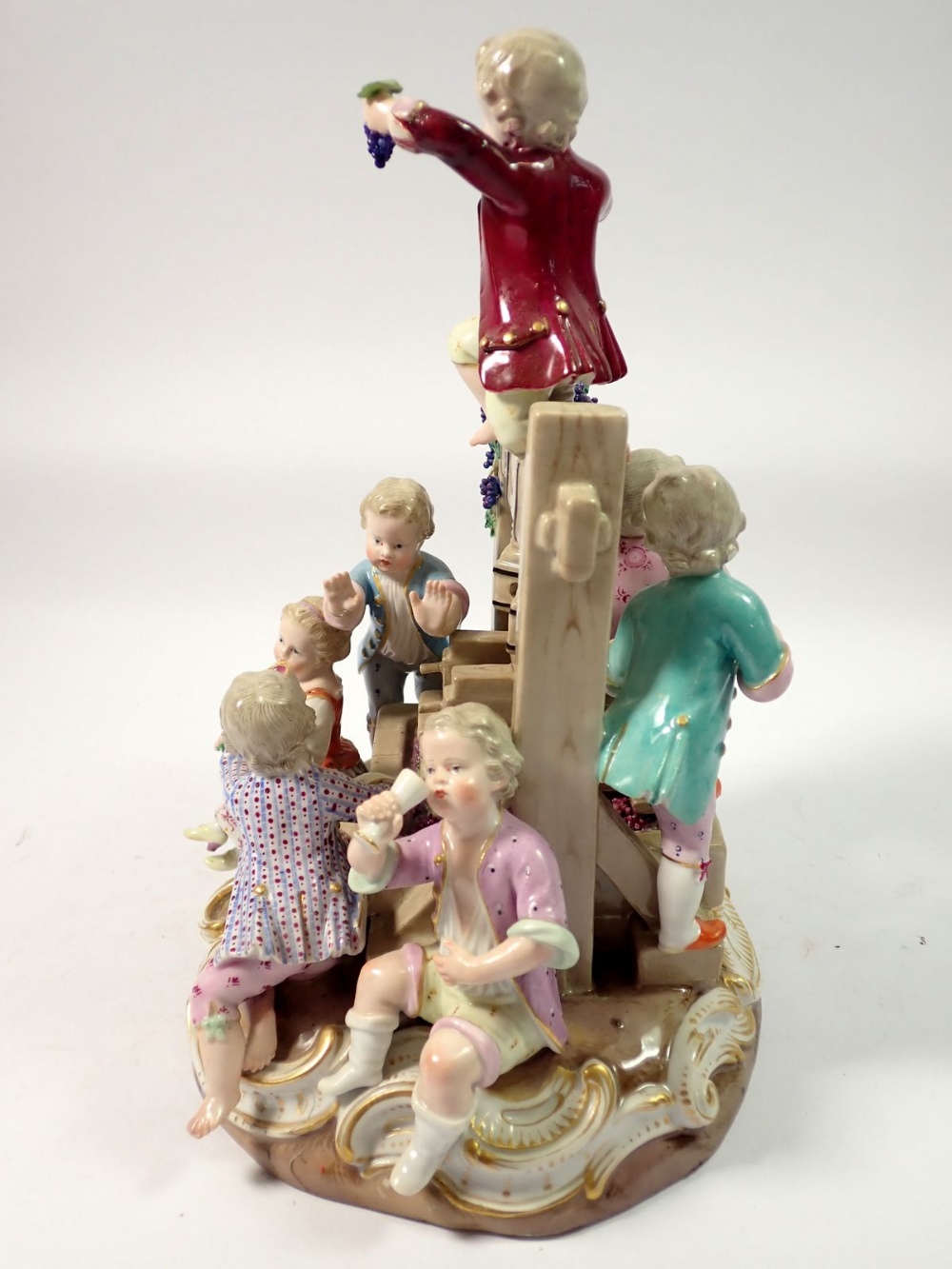 A 19th century Meissen group of children playing around a wine press, crossed swords mark to base, - Image 3 of 7