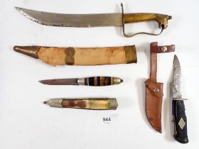 A Solingen small serrated knife, an Egyptian decorative knife and a horn handled knife