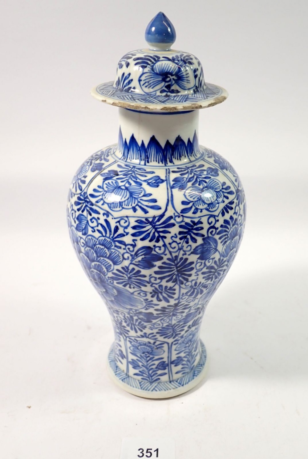 A Chinese 18th century blue and white baluster vase and cover with all over floral decoration, 28cm - Image 2 of 7