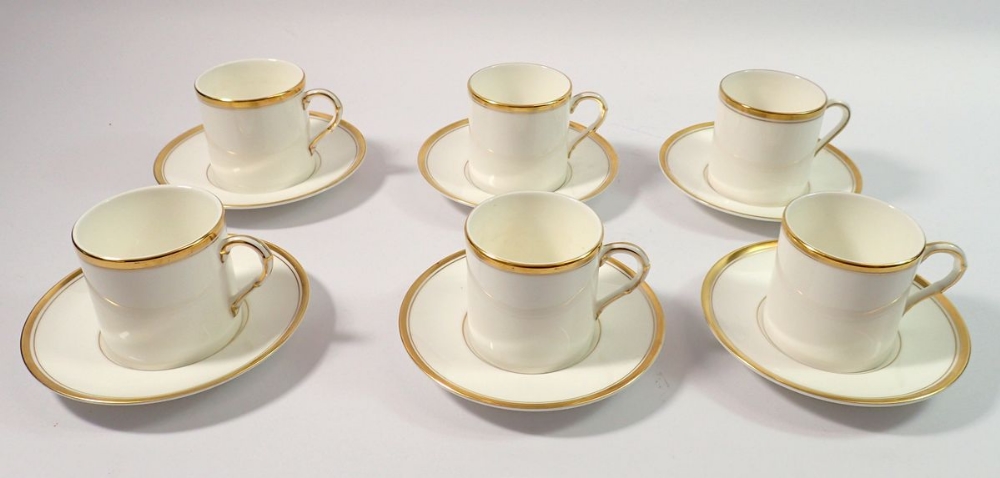 A Royal Worcester set of six gilt edged coffee cups