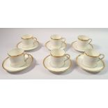 A Royal Worcester set of six gilt edged coffee cups