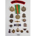 A box of military badges etc.