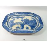 A 19th century blue and white meat plate printed chinoiserie scene, 46cm wide