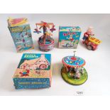 Three Japanese mechanical tin plate toys - 'Vacationland Airplane rRde' and 'Happy Grandpa with