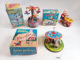 Three Japanese mechanical tin plate toys - 'Vacationland Airplane rRde' and 'Happy Grandpa with