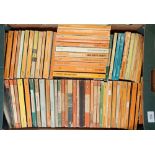 A box of vintage Penguin paperback books