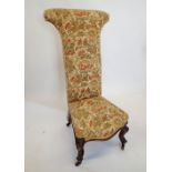 A Victorian pine dieu chair on carved scroll feet and castors