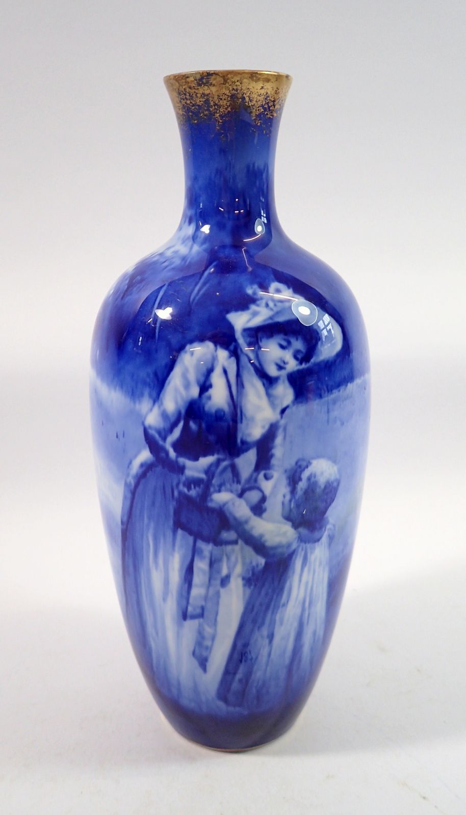 A Royal Doulton blue Faience vase painted mother and child, 22.5cm tall