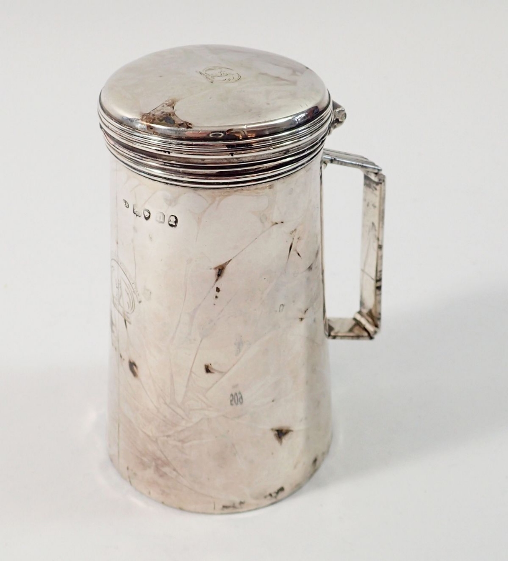 A late Georgian silver travel or military officer's shaving mug with folding handle and hinged