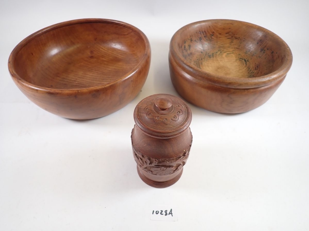 Two wooden fruit bowls and a wooden pot