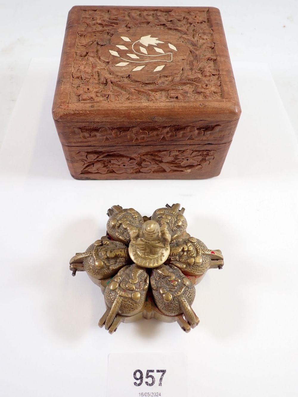 An Indian brass Kumkum Hindu spice box and a carved wooden box