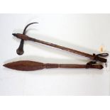 A short ceremonial war axe, 48cm and a carved paddle club, 49cm