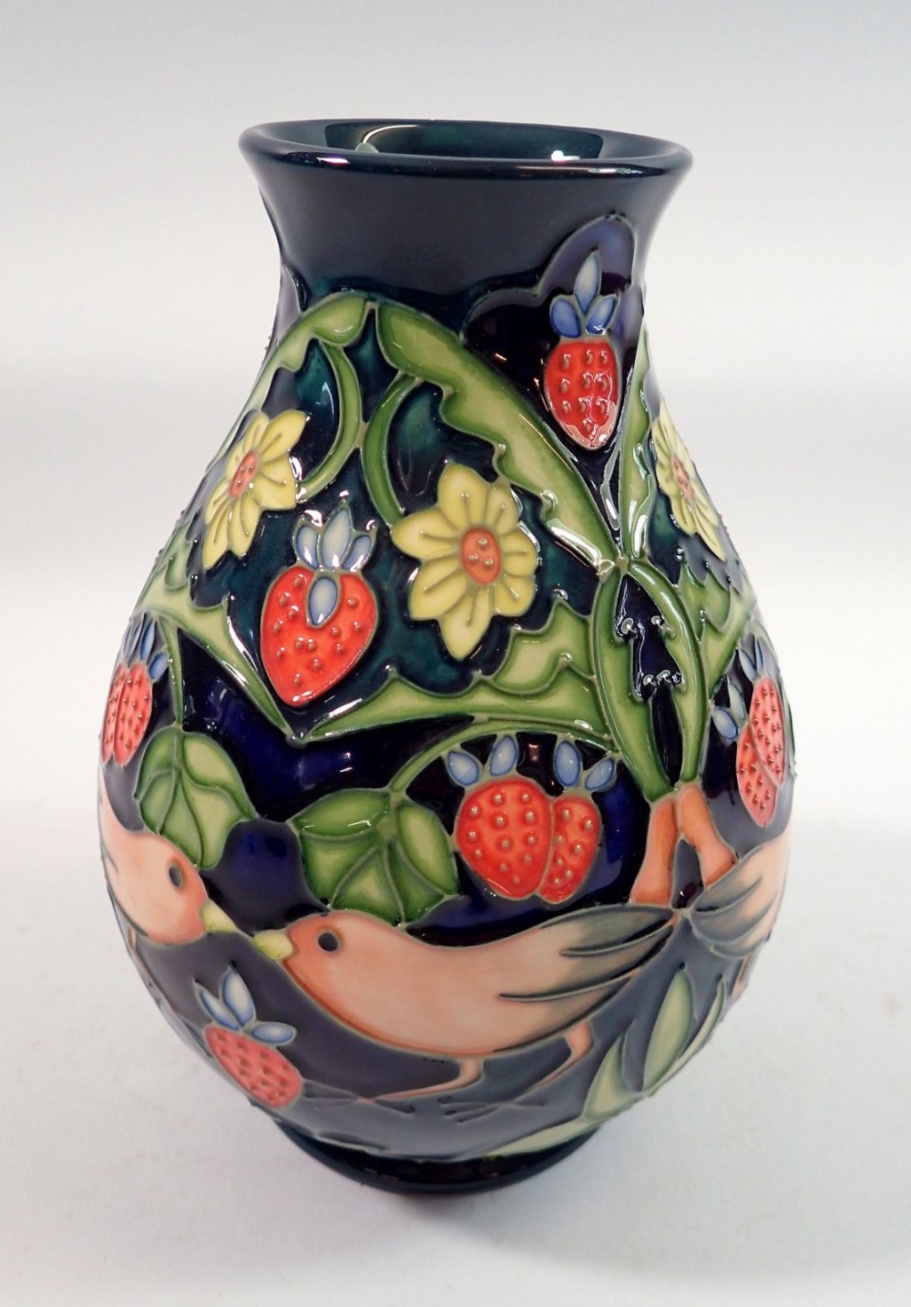 A Moorcroft vase in the Strawberry Thief pattern, 19cm tall