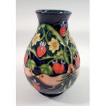 A Moorcroft vase in the Strawberry Thief pattern, 19cm tall