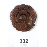 A Chinese carved jade amulet/pendant, 5cm wide