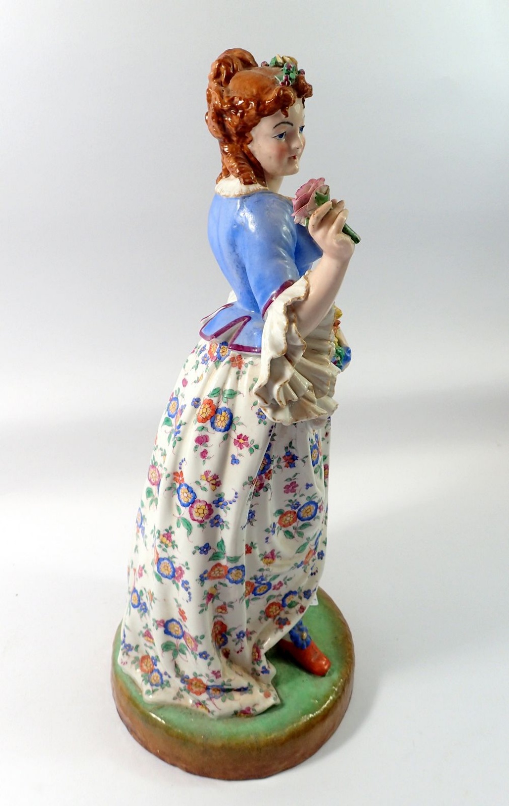 A 19th century French porcelain large figure of a woman with flowers, 44cm tall - Image 2 of 2