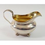 A Victorian silver milk jug with cast floral handle, London 1851, by Samuel Hayne & Dudley Cater,