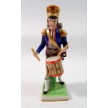 A Capodimonte figure of a soldier drumming, 16.5cm