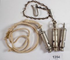 An Adie Bros WWII military whistle, an ARP whistle and a Metropolitan whistle