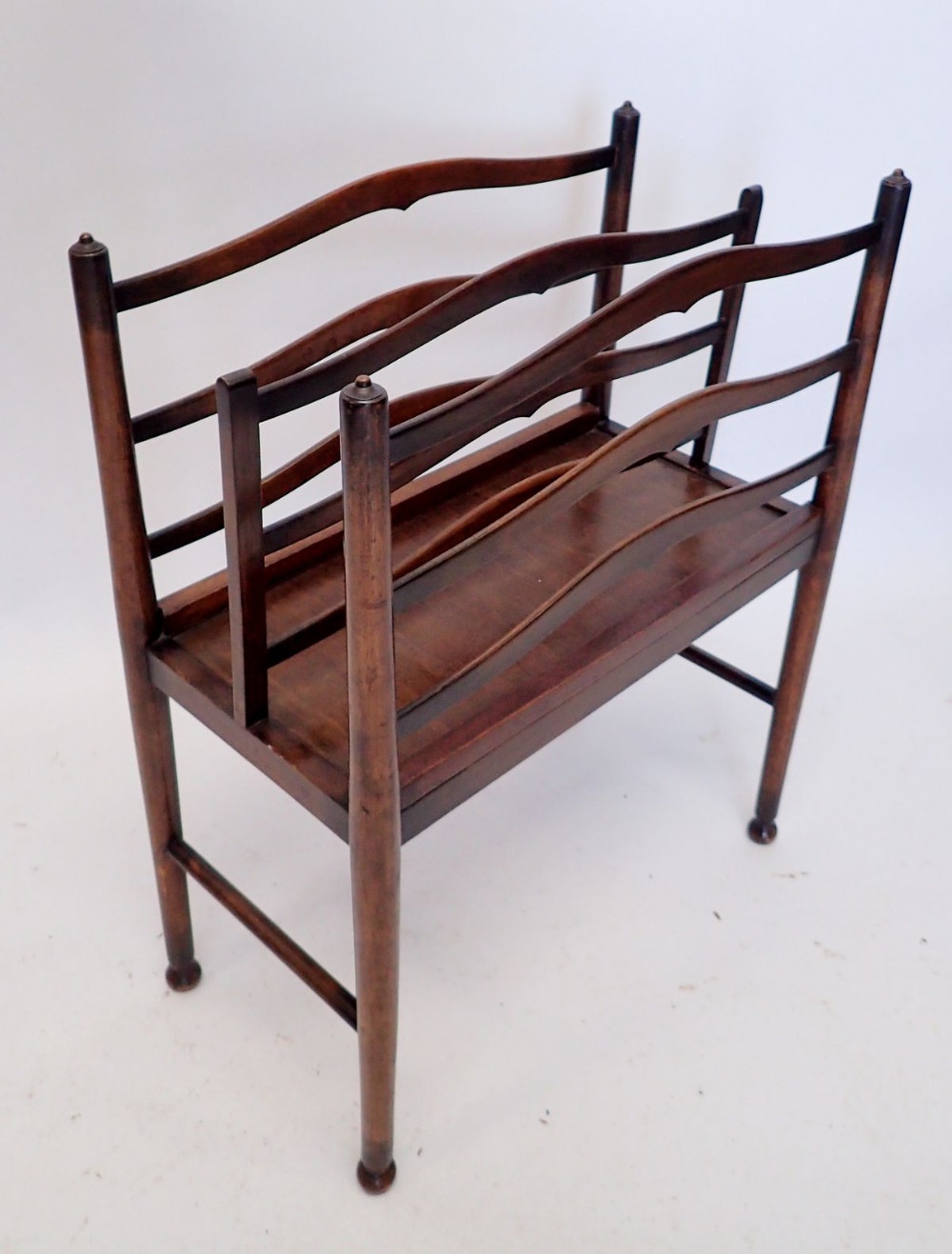 A mid 20th century mahogany magazine rack, 50cm wide