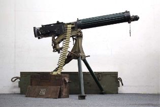 A deactivated .303 Vickers Heavy Machine Gun, with tripod, ammunition box and transit case, no.
