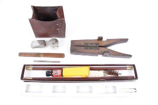 A wooden folding boot jack, 12 bore Parker Hale cleaning kit, wood and brass field cutlery set,