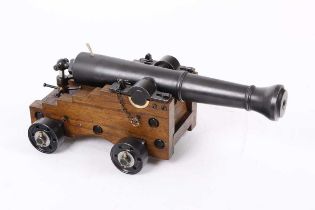 Ⓕ (S1) A scratch-built .53 black powder cannon, with a 12 ins smooth-bored barrel, on an oak