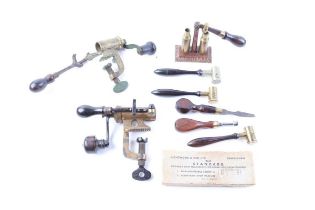 Two 12 bore roll-turnover tools, together with a 12 bore brass capper/decapper, Lightwood & Son