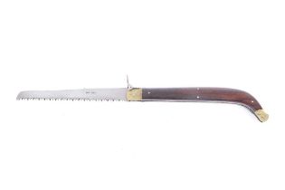 Folding saw by Whitby, 7½ ins blade, brass mounted wooden handle