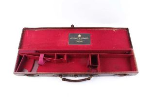 A leather Rook Rifle case with brass corners and fitted interior for a 26 ins barrel (will take up