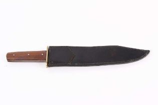 Bowie knife, 11½ ins blade, brass guard, wood grips, in a leather sheath