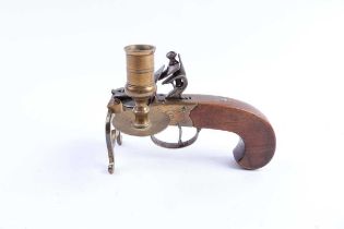 A brass flintlock tinder lighter