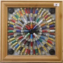 A framed and glazed cartridge display board, 25 x 25 ins (inert) Once-fired cases