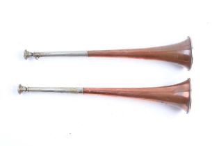 A pair of copper and nickel hunting horns by Henry Keat & Sons, 105 & 103 Matthias Rd. Stoke