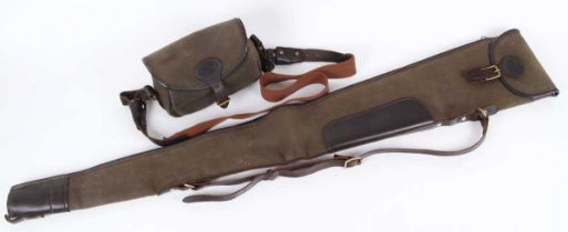 A Kennedy (Bisley) canvas and leather fleece-lined gun slip with matching cartridge bag