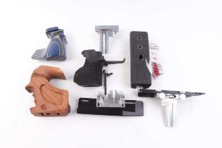 Three target-pistol grips inc. Feinwerkbau, a forend and three adjustment fittings