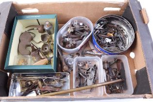 A tray containing various locks and other metalwork, brass furniture and tooling