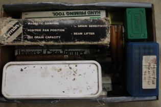 Box of reloading equipment to include Lyman Universal trimmer, Lyman scales, RCBS hand priming tool,
